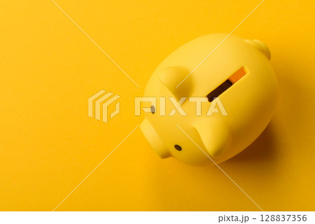 Piggy bank as a financial conceptual background with coins, doing business 128837356