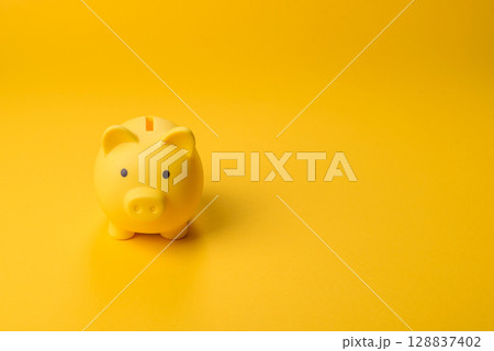 Piggy bank as a financial conceptual background with coins, doing business Piggy bank as a financial conceptual background with coins, doing business 128837402