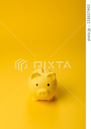 Piggy bank as a financial conceptual background with coins, doing business Piggy bank as a financial conceptual background with coins, doing business 128837403