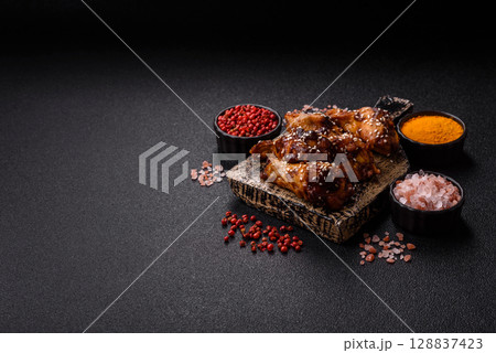 Grilled chicken wings in teriyaki sauce. Hot spicy takeaway food Grilled chicken wings in teriyaki sauce. Hot spicy takeaway food 128837423