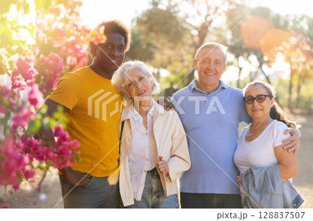 Portrait of happy smiling mature people outdoors together 128837507