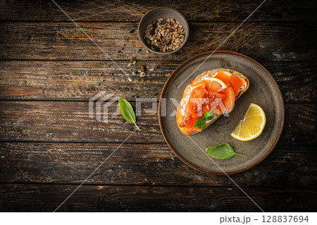 Sandwich with cream cheese and salmon 128837694