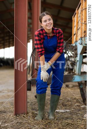 Young female worker posing on farm 128837792