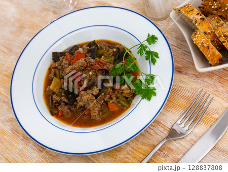 Vegetable stew served with minced meat 128837808