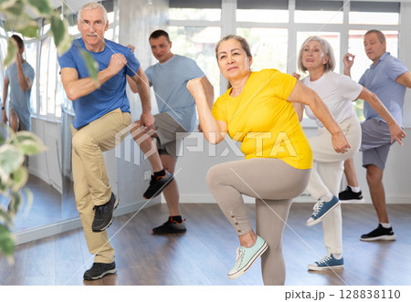 Elderly woman dances modern dances in group Elderly woman dances modern dances in group 128838110