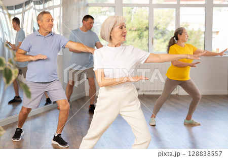 Elderly woman dances modern dances in group Elderly woman dances modern dances in group 128838557
