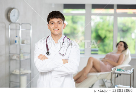 Portrait of male beautician in white coat at body aesthetics clinic Portrait of male beautician in white coat at body aesthetics clinic 128838866
