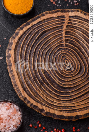 Wooden cutting board blank as a backdrop for cooking in the kitchen 128839000