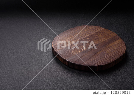Wooden cutting board blank as a backdrop for cooking in the kitchen 128839012