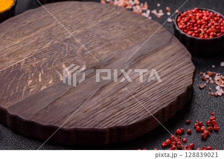 Wooden cutting board blank as a backdrop for cooking in the kitchen Wooden cutting board blank as a backdrop for cooking in the kitchen 128839021