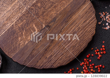 Wooden cutting board blank as a backdrop for cooking in the kitchen Wooden cutting board blank as a backdrop for cooking in the kitchen 128839022