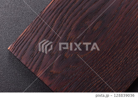 Wooden cutting board blank as a backdrop for cooking in the kitchen 128839036