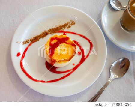 Tender creamy mousse cheesecake with currant sauce Tender creamy mousse cheesecake with currant sauce 128839050
