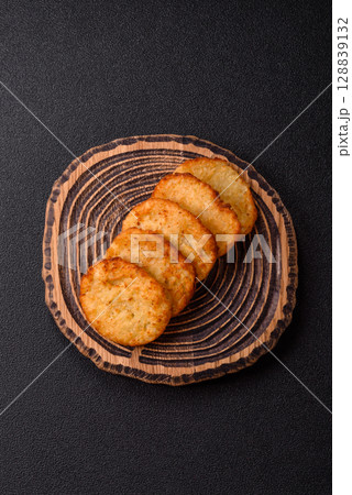 Potato hash browns, a meal with onions, cabbage in the form of fritters Potato hash browns, a meal with onions, cabbage in the form of fritters 128839132