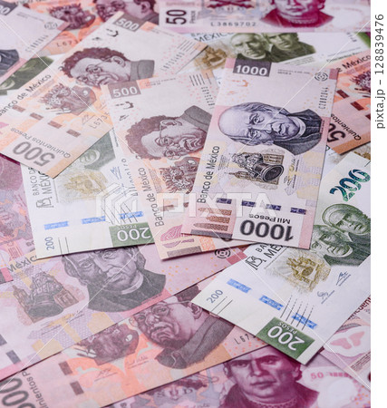 Money, Mexican currency, peso banknotes. Conceptual financial background Money, Mexican currency, peso banknotes. Conceptual financial background 128839476
