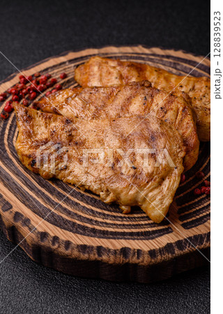Chicken breast, grilled fillet, meat meal on a plate 128839523