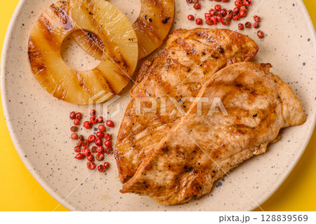 Chicken breast, grilled fillet, meat meal on a plate 128839569