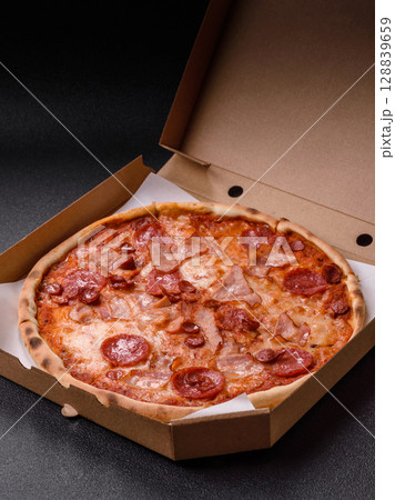 Italian pepperoni pizza with cheese and salami, tomatoes and sauce 128839659