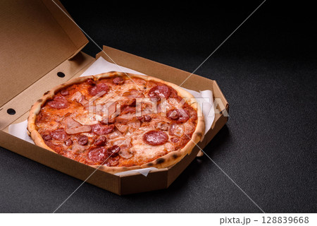 Italian pepperoni pizza with cheese and salami, tomatoes and sauce Italian pepperoni pizza with cheese and salami, tomatoes and sauce 128839668