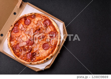 Italian pepperoni pizza with cheese and salami, tomatoes and sauce Italian pepperoni pizza with cheese and salami, tomatoes and sauce 128839669