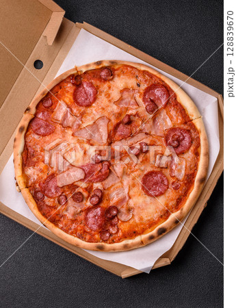 Italian pepperoni pizza with cheese and salami, tomatoes and sauce 128839670