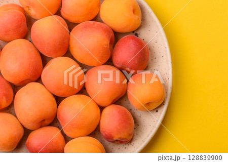 Fresh ripe fruit apricots are red yellow in color Fresh ripe fruit apricots are red yellow in color 128839900