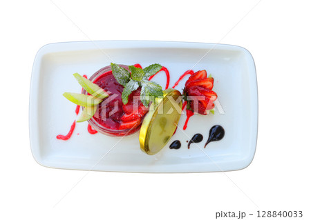 Delicious panna cotta with strawberry coulis and fresh berries on wooden background Delicious panna cotta with strawberry coulis and fresh berries on wooden background 128840033
