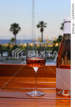 glass of rose or blush wine on the beach glass of rose or blush wine on the beach 128840264