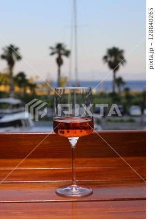 glass of rose or blush wine on the beach glass of rose or blush wine on the beach 128840265