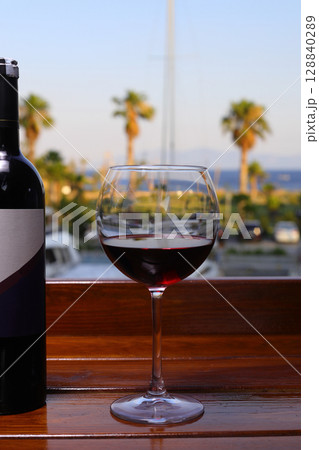 glass of red wine on the beach glass of red wine on the beach 128840289