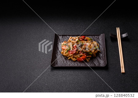 Chinese or Thai food, rice noodles with meat, salt and spices. Asian food 128840532