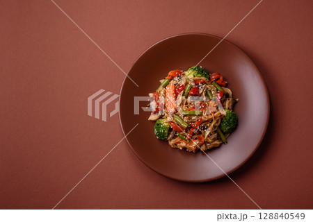 Chinese or Thai food, rice noodles with meat, salt and spices. Asian food 128840549
