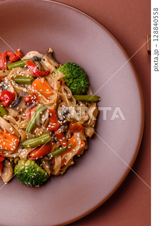 Chinese or Thai food, rice noodles with meat, salt and spices. Asian food Chinese or Thai food, rice noodles with meat, salt and spices. Asian food 128840558