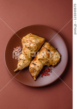 Grilled chicken leg or quarter. Barbecued meat with salt and spices Grilled chicken leg or quarter. Barbecued meat with salt and spices 128840670