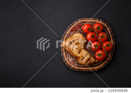 Grilled chicken leg or quarter. Barbecued meat with salt and spices Grilled chicken leg or quarter. Barbecued meat with salt and spices 128840686