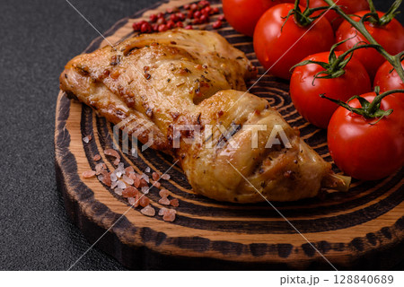 Grilled chicken leg or quarter. Barbecued meat with salt and spices Grilled chicken leg or quarter. Barbecued meat with salt and spices 128840689