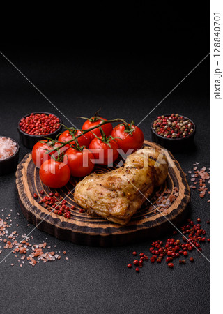 Grilled chicken leg or quarter. Barbecued meat with salt and spices 128840701