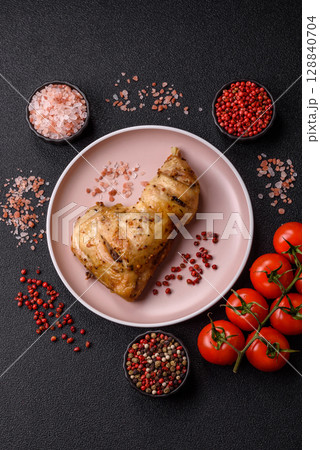 Grilled chicken leg or quarter. Barbecued meat with salt and spices 128840704
