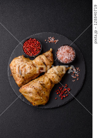 Grilled chicken leg or quarter. Barbecued meat with salt and spices 128840719