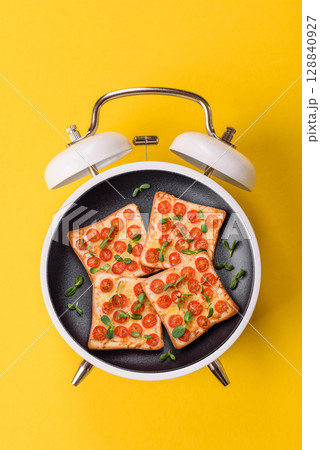 Sandwich with toast, cherry tomatoes, cheese, micro greens, salt and spices 128840927