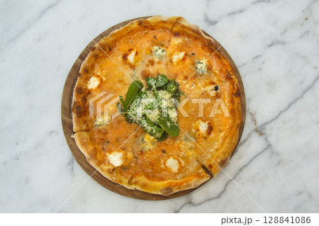 Brazilian pizza with sun-dried tomatoes, arugula and mozzarella. Traditional Brazilian Pizza Brazilian pizza with sun-dried tomatoes, arugula and mozzarella. Traditional Brazilian Pizza 128841086
