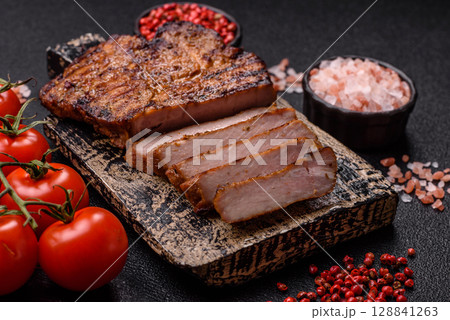 Meat, steak, beef tenderloin cooked on grill. Juicy steak as a food background Meat, steak, beef tenderloin cooked on grill. Juicy steak as a food background 128841263
