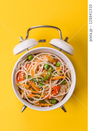 Italian pasta with meat, sauce and vegetables. Conceptual background time to eat pasta Italian pasta with meat, sauce and vegetables. Conceptual background time to eat pasta 128841310