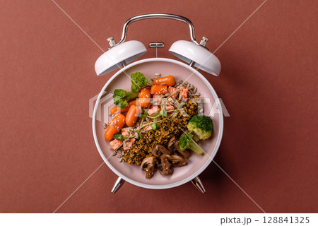 Vegetarian salad with quinoa, vegetables and meat. Conceptual background time to eat vegetarian food Vegetarian salad with quinoa, vegetables and meat. Conceptual background time to eat vegetarian food 128841325