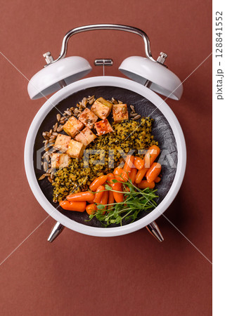 Vegetarian salad with quinoa, vegetables and meat. Conceptual background time to eat vegetarian food Vegetarian salad with quinoa, vegetables and meat. Conceptual background time to eat vegetarian food 128841552