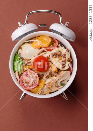 Italian pasta with meat, sauce and vegetables. Conceptual background time to eat pasta Italian pasta with meat, sauce and vegetables. Conceptual background time to eat pasta 128841553