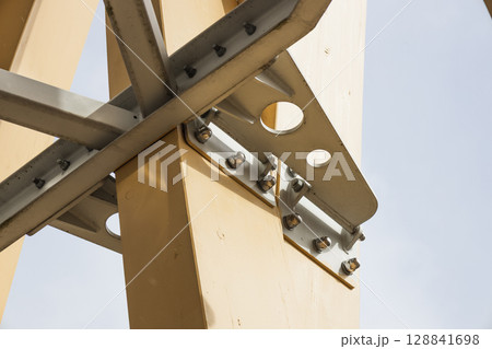 Engineered Timber Column with Steel Plate Connection and Bolts in Modern Hybrid Construction 128841698
