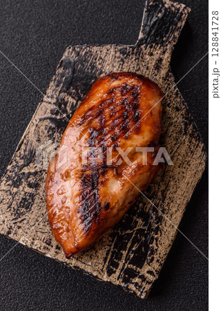 Chicken breast, grilled fillet, meat meal on a plate. Grilled poultry for dinner 128841728