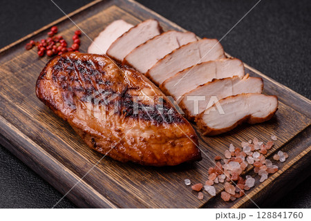 Chicken breast, grilled fillet, meat meal on a plate. Grilled poultry for dinner 128841760