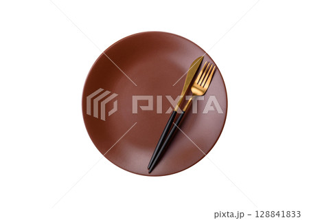 Empty plate with utensils as a conceptual background for lunch, breakfast, meal Empty plate with utensils as a conceptual background for lunch, breakfast, meal 128841833